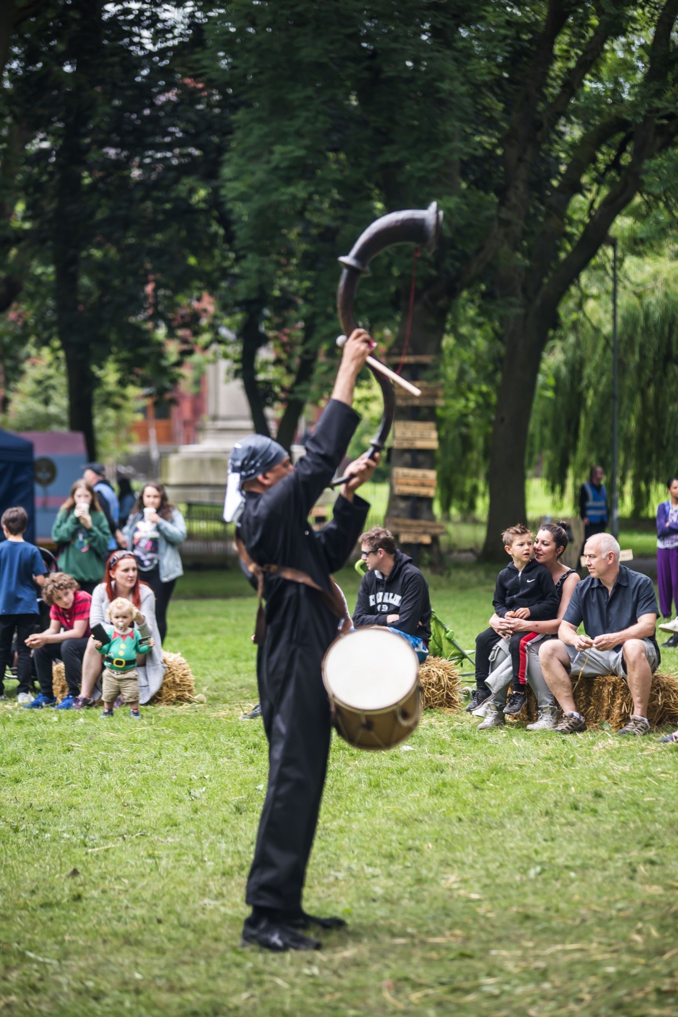 person playing a large horn