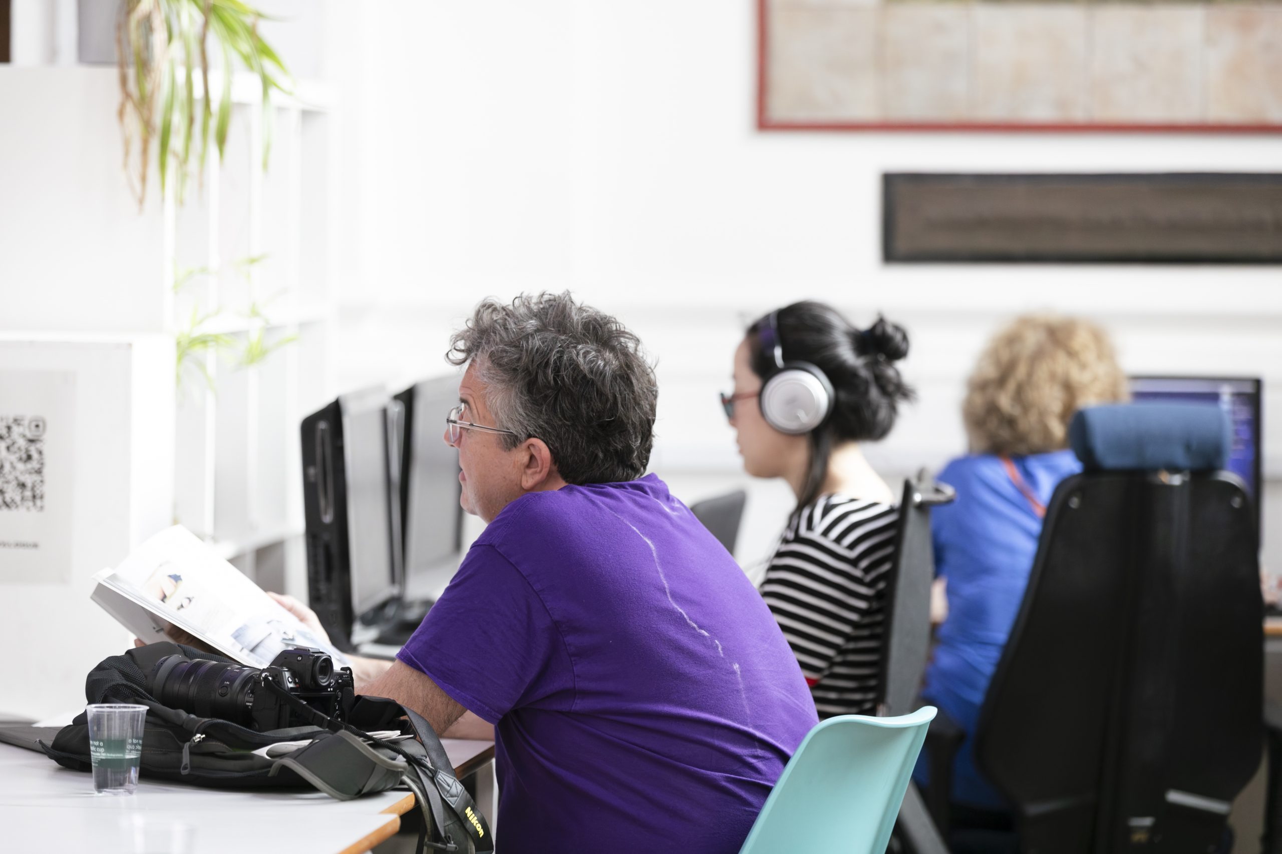 A group of people watching DVDs in LADA's Study Room