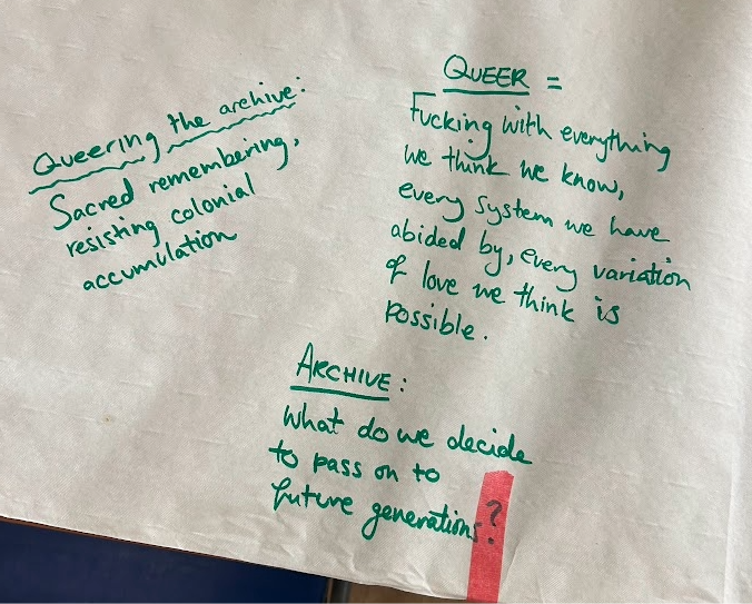 Notes written in green pen on a paper table cloth.